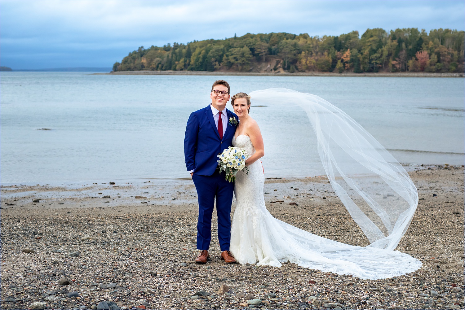 Wedding couple in front of the islands off the coast of Bar Harbor Maine