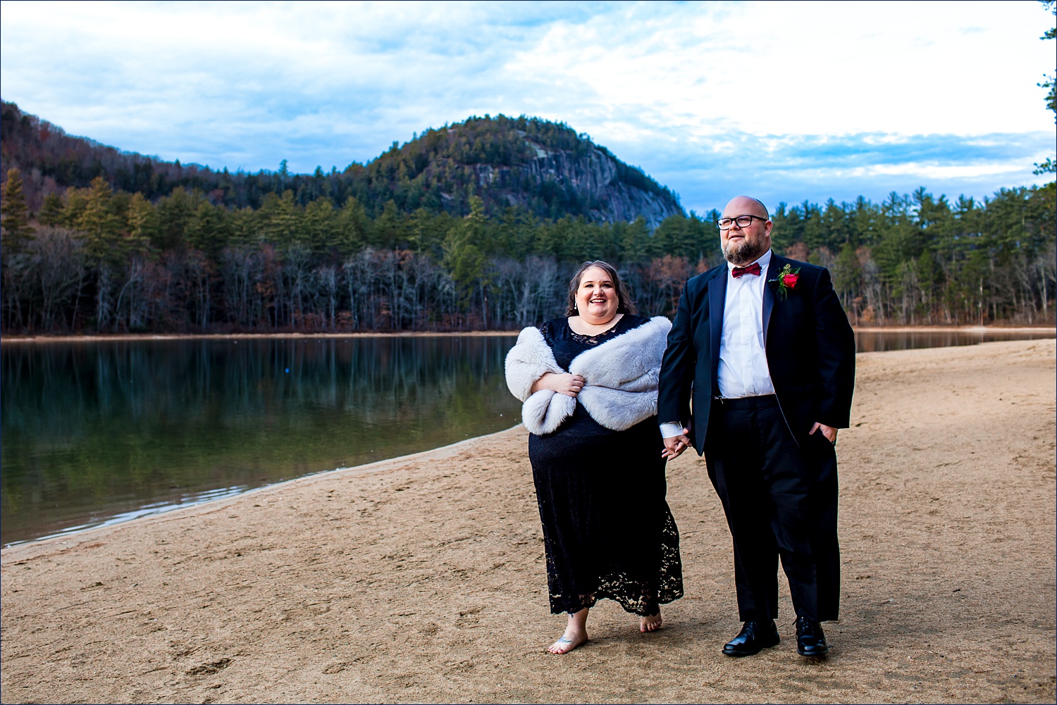 Wedding couple walking along the shores of Echo Lake in NH on their elopement