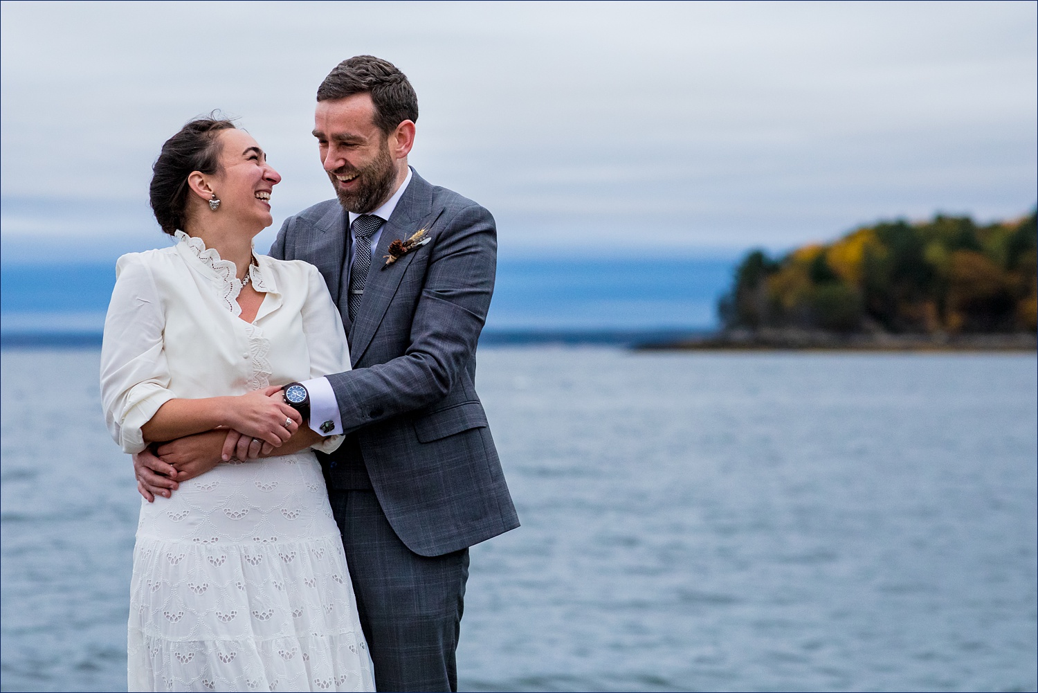 The bride and groom at their College of the Atlantic wedding day in Maine are all smiles