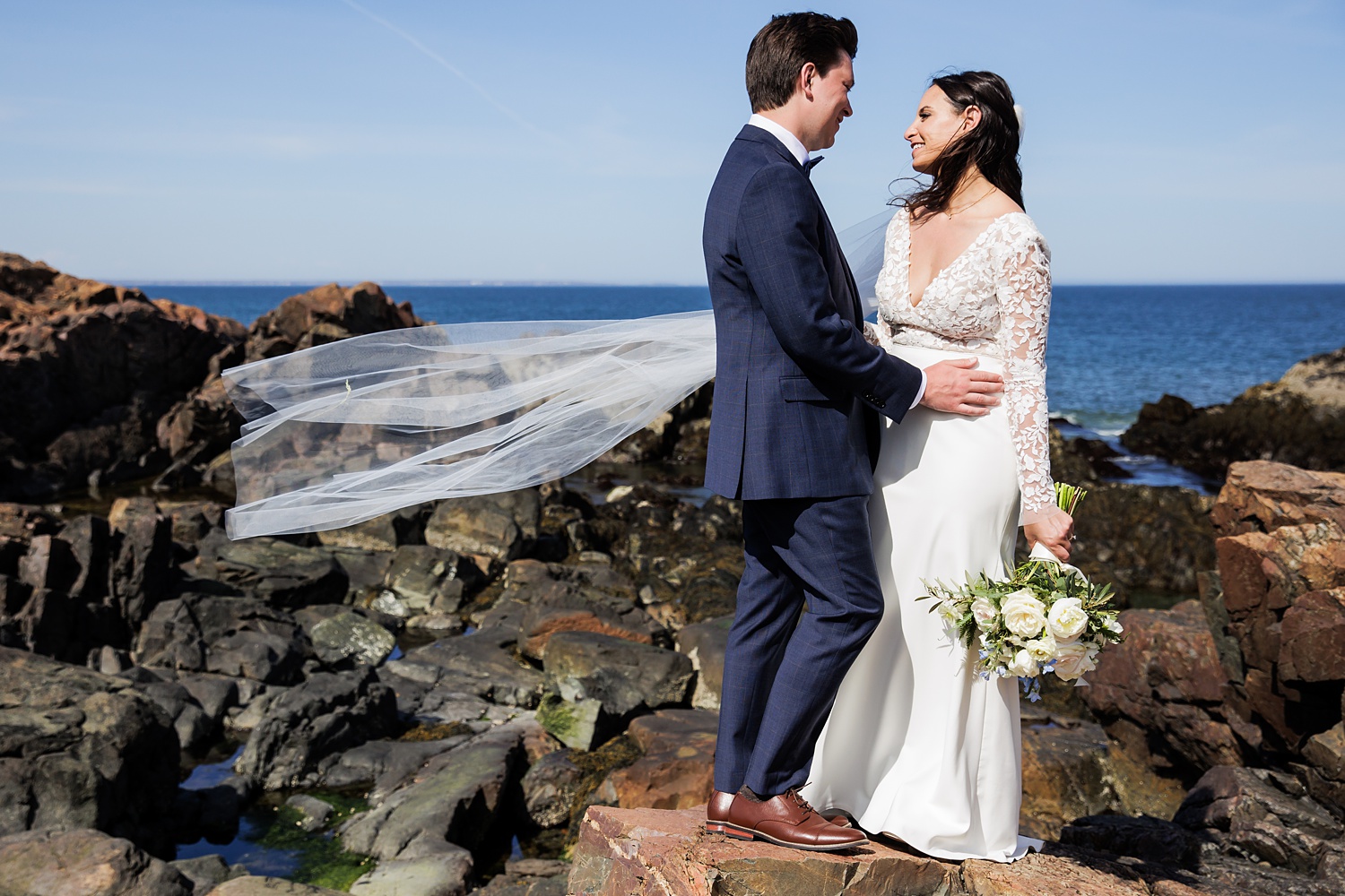 The bride and groom out on the rocks at Marginal Way in Ogunquit Maine