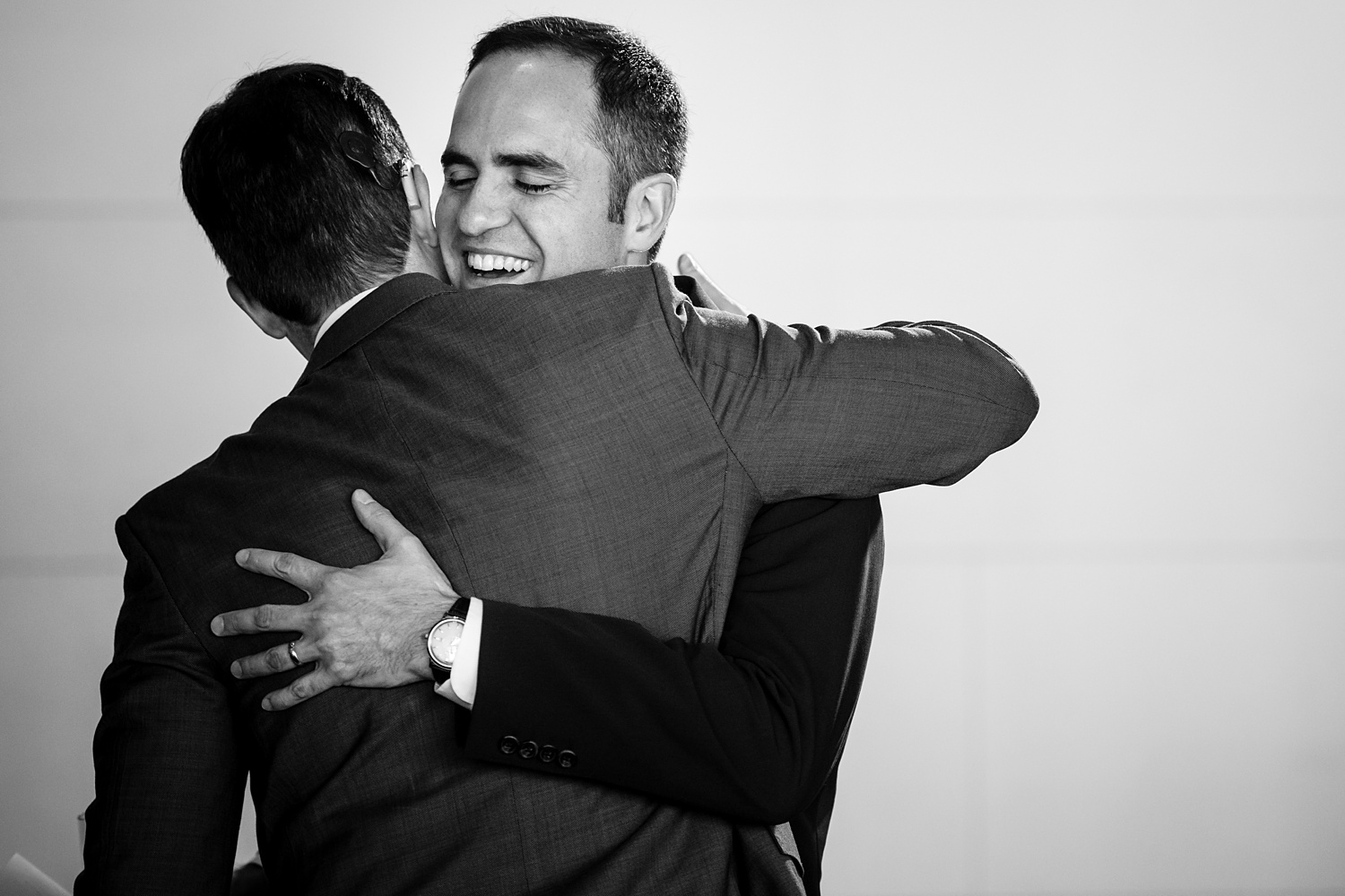 Brothers give each other a hug after a touching wedding toast