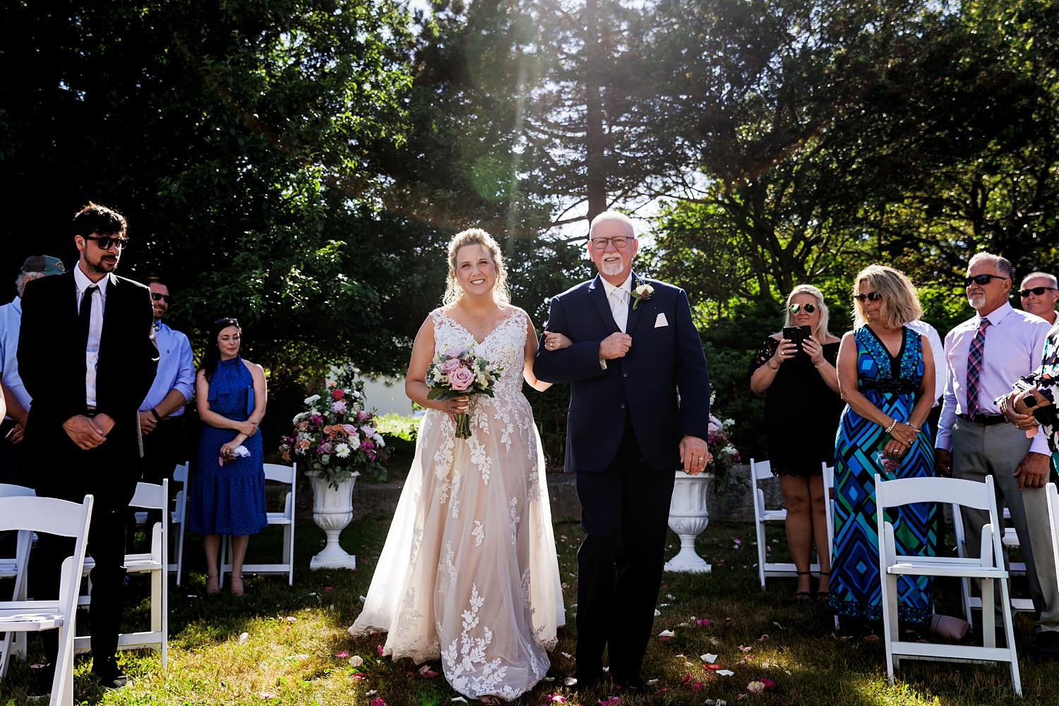 The father of the bride walks his daughter down the aisle