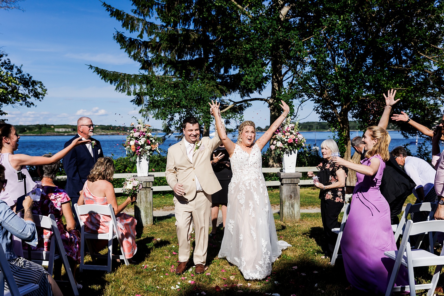 A celebratory petal toss after the Willard Beach ceremony at SMCC in South Portland Maine