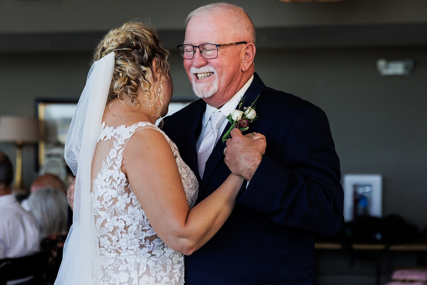 The bride and her father share a dance at the wedding reception in Maine