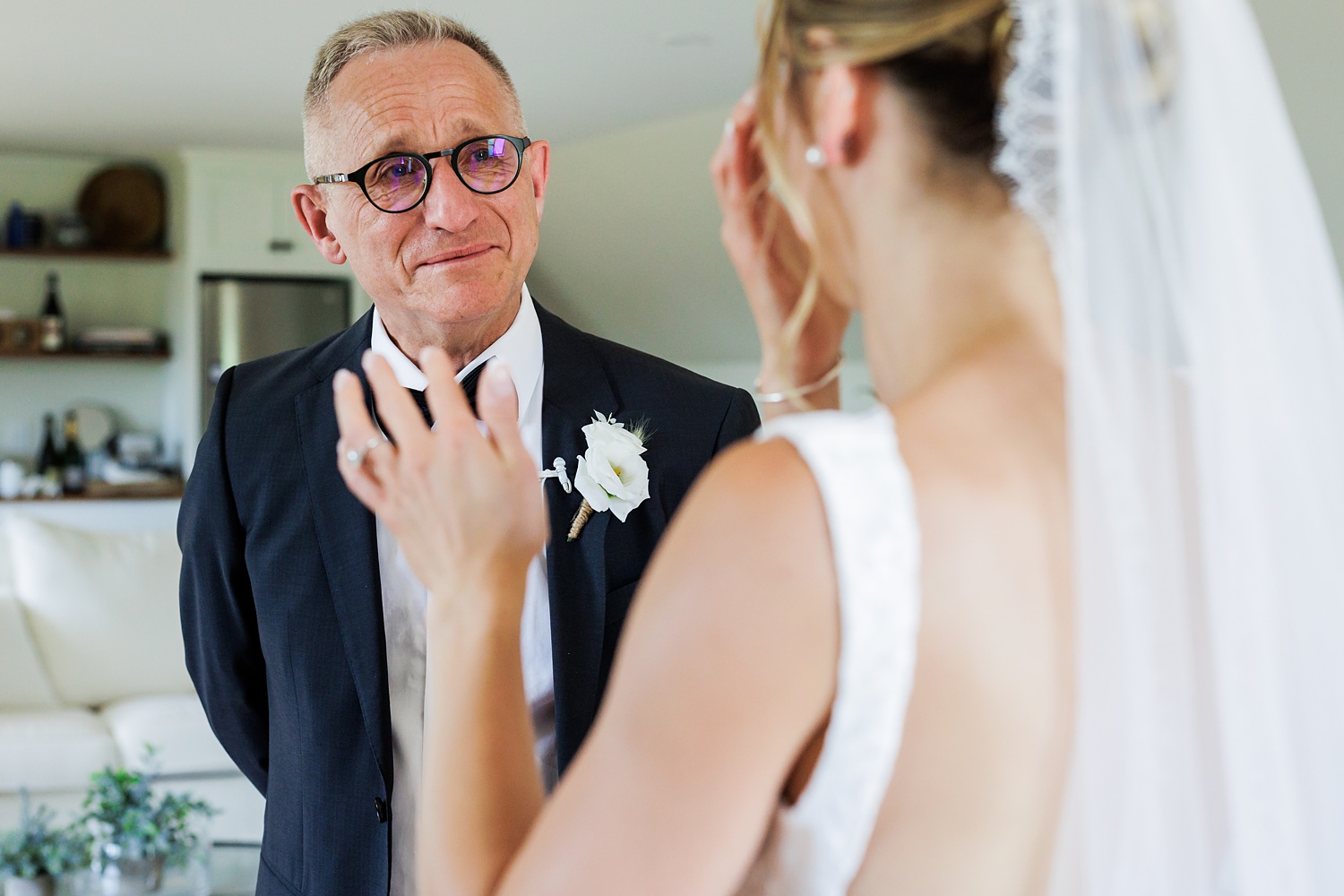 The father of the bride reacts to seeing his daughter in her dress