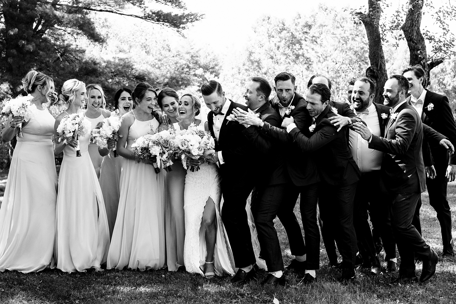 The wedding party shows some love for the newlyweds after the ceremony