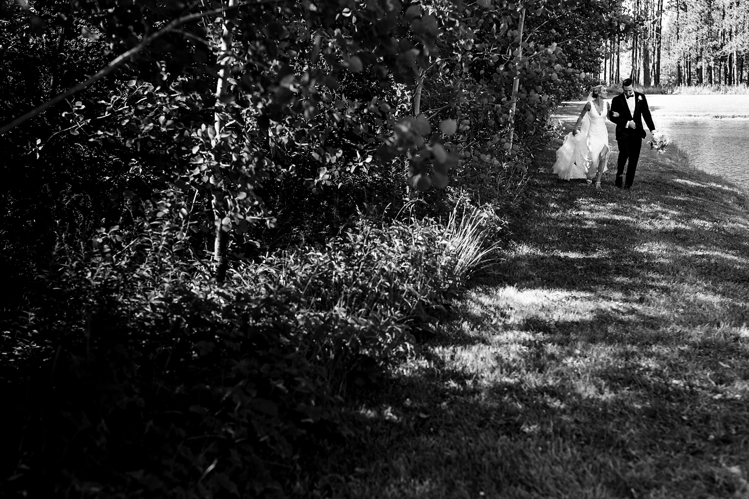 The bride and groom rush to the wedding reception at Cunningham Farm in Maine