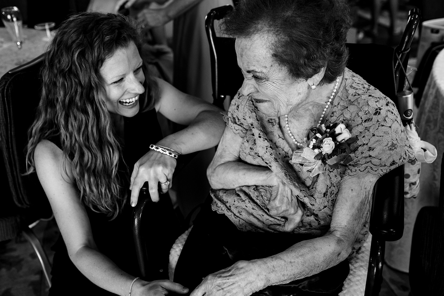 Grandma and her granddaughter on the wedding day share a moment