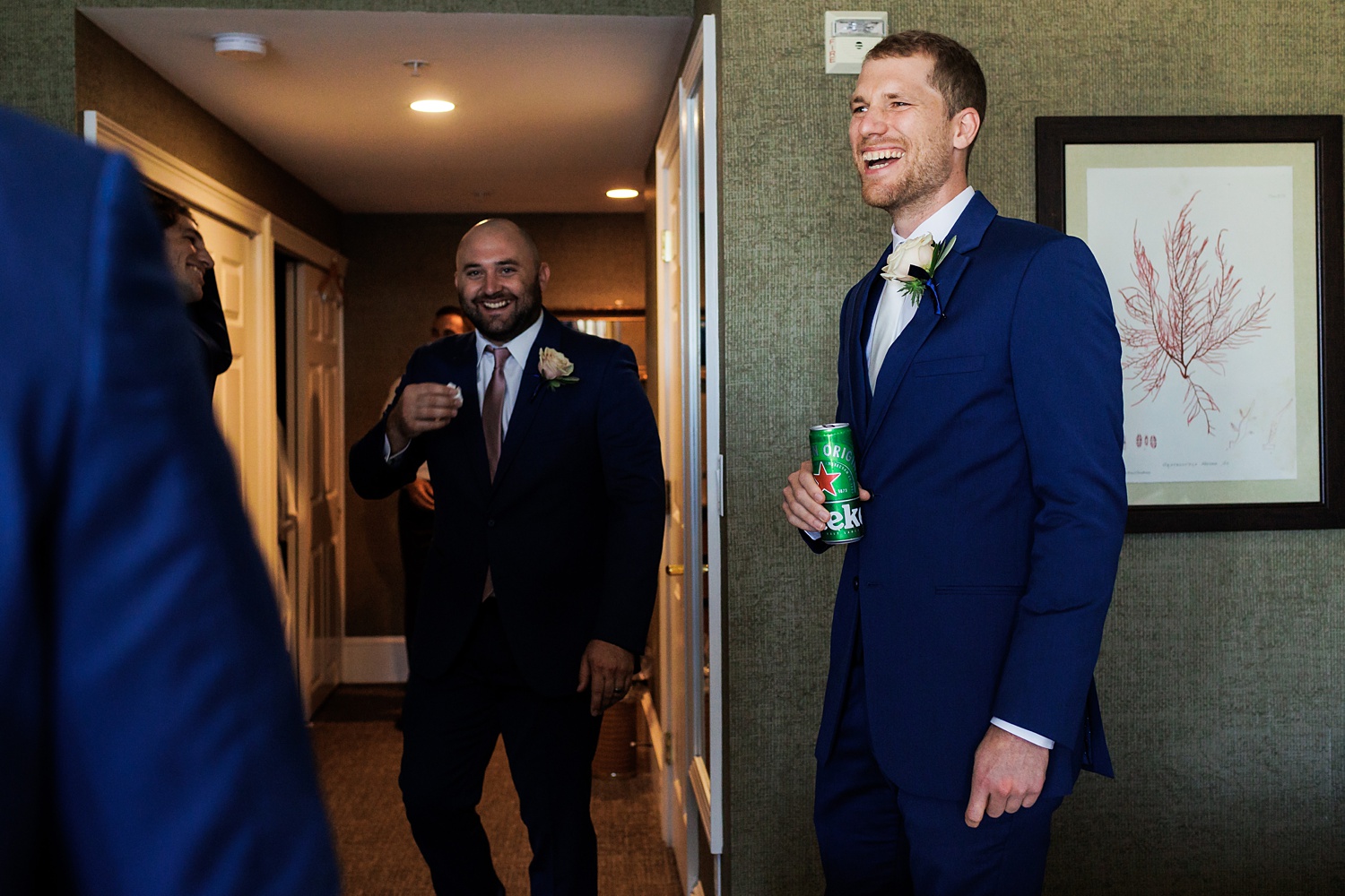 The groom shares a drink with his friends before the wedding starts