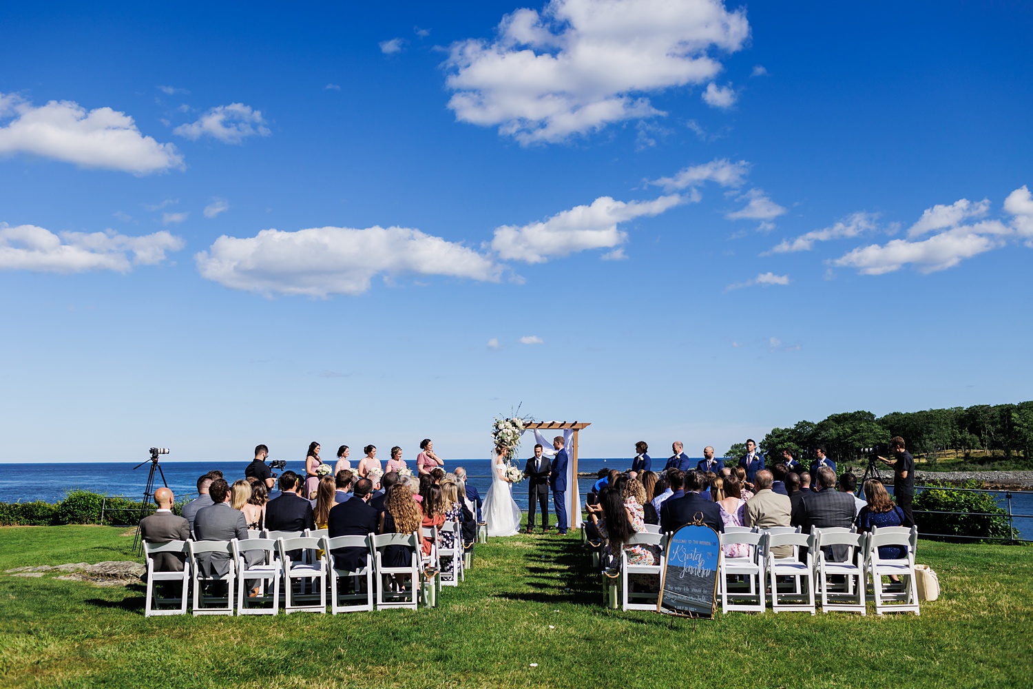The wedding on the lawn of Stageneck Inn in York Maine on a sunny day