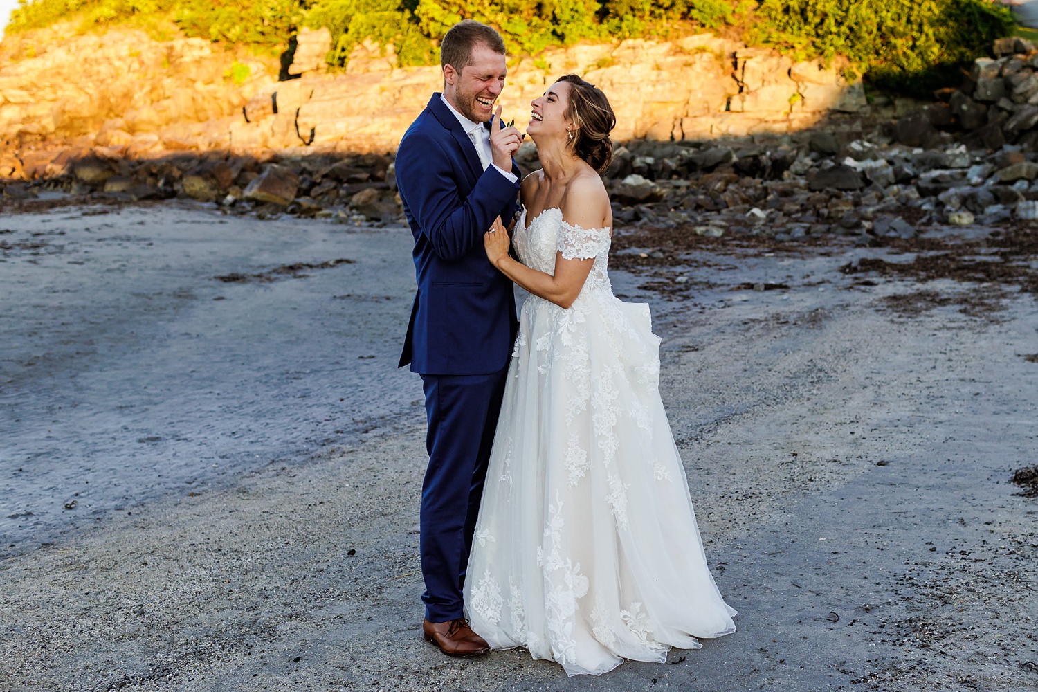 The bride and groom can't stop the laughter and happiness on their wedding day in Maine