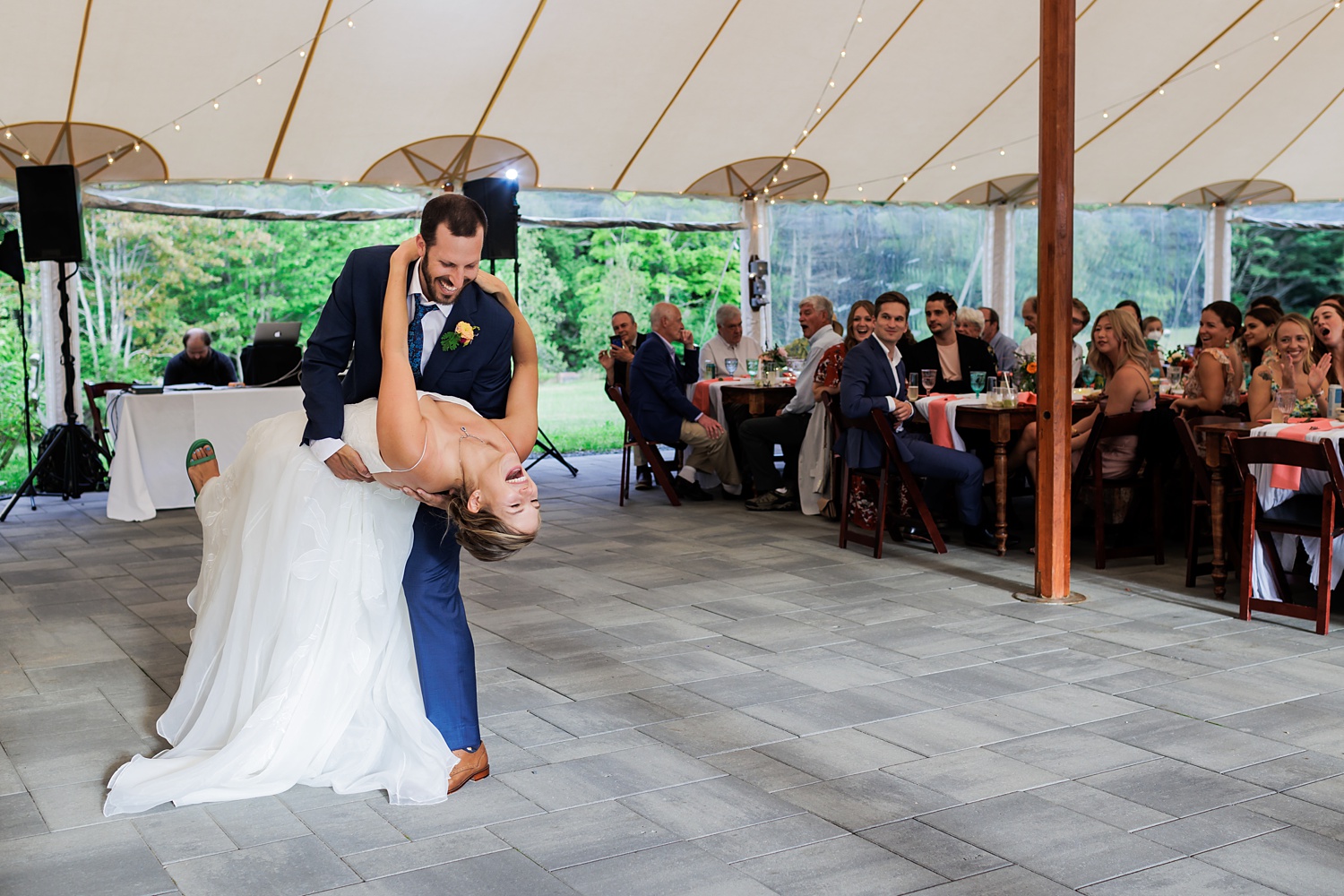 Dipping the bride during the first dance under the tent in NH