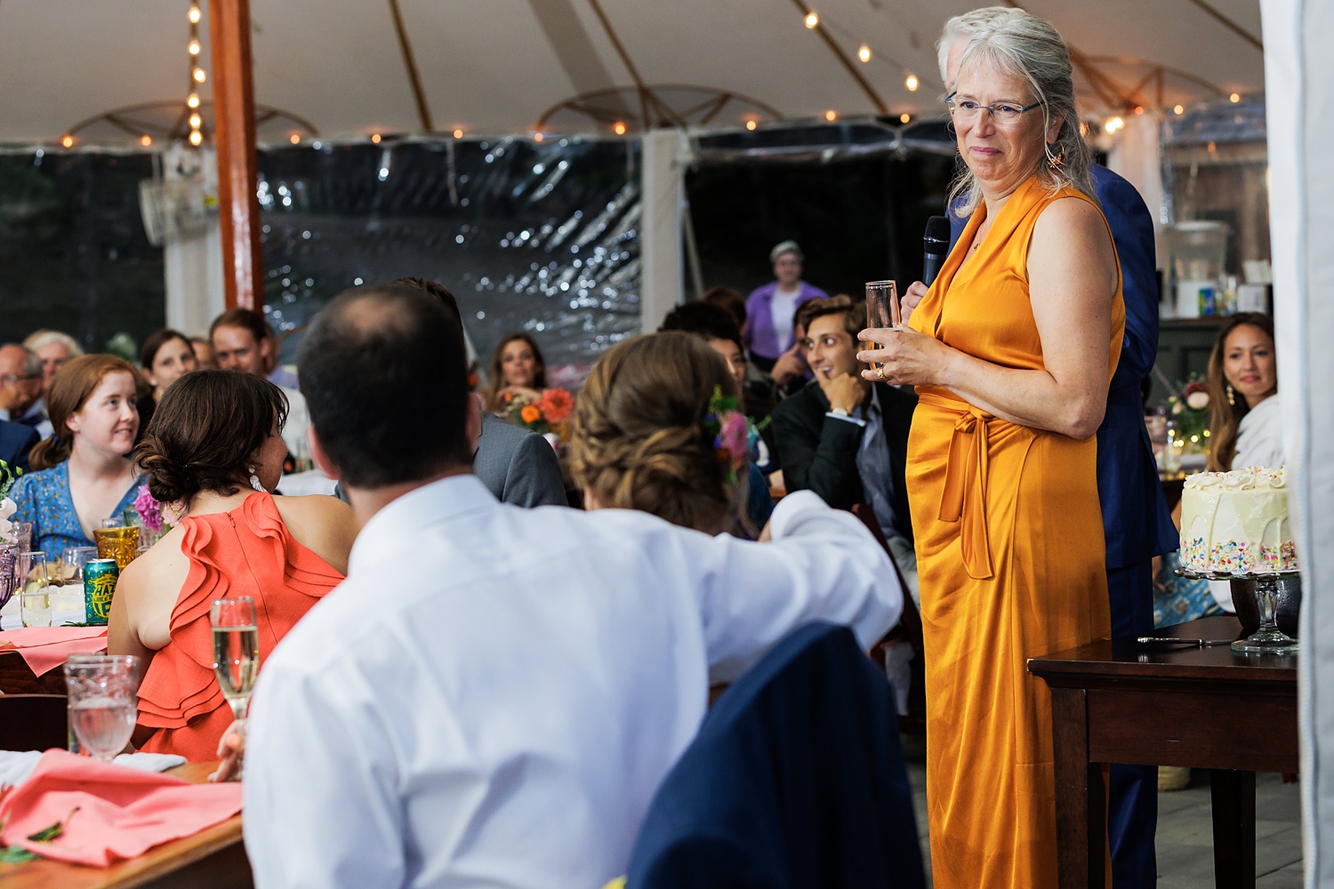 Bride's mom gives a loving look at the couple during toasts