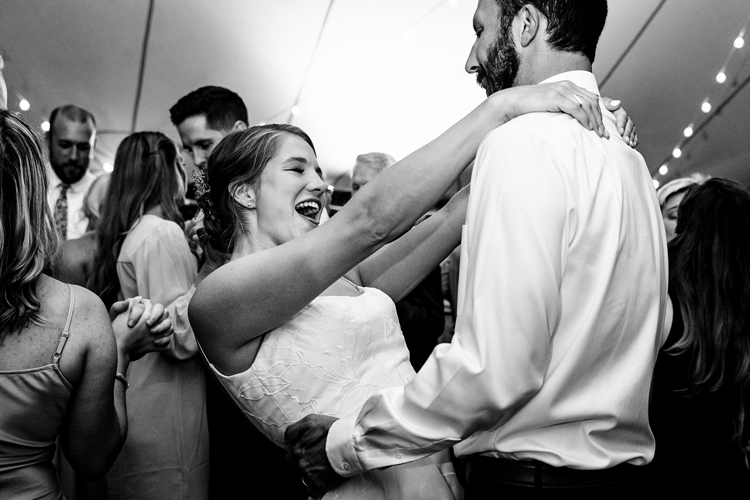 Dancing under the tent after their White Mountain NH wedding
