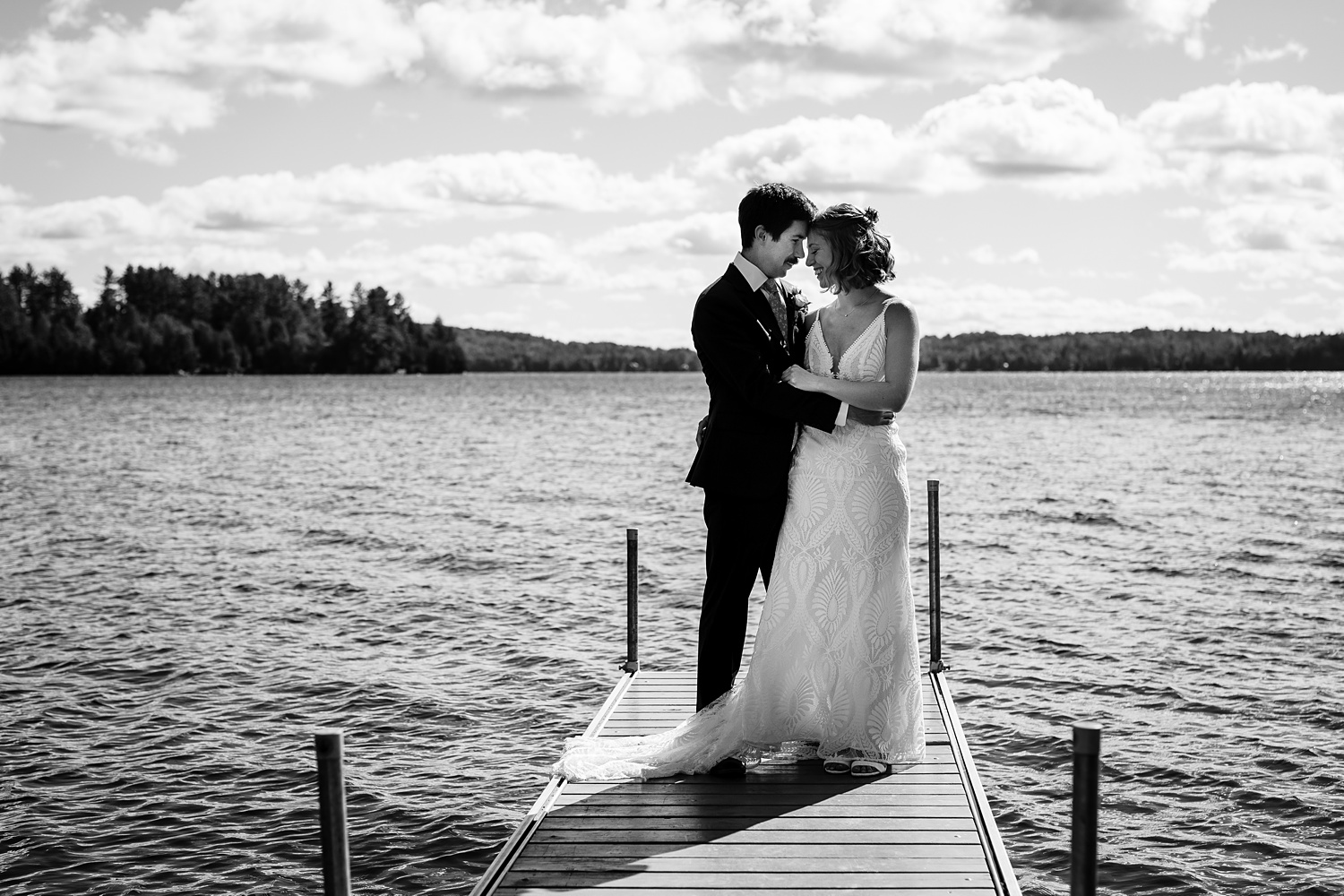 The bride and groom out on the lake for their fall wedding day 
