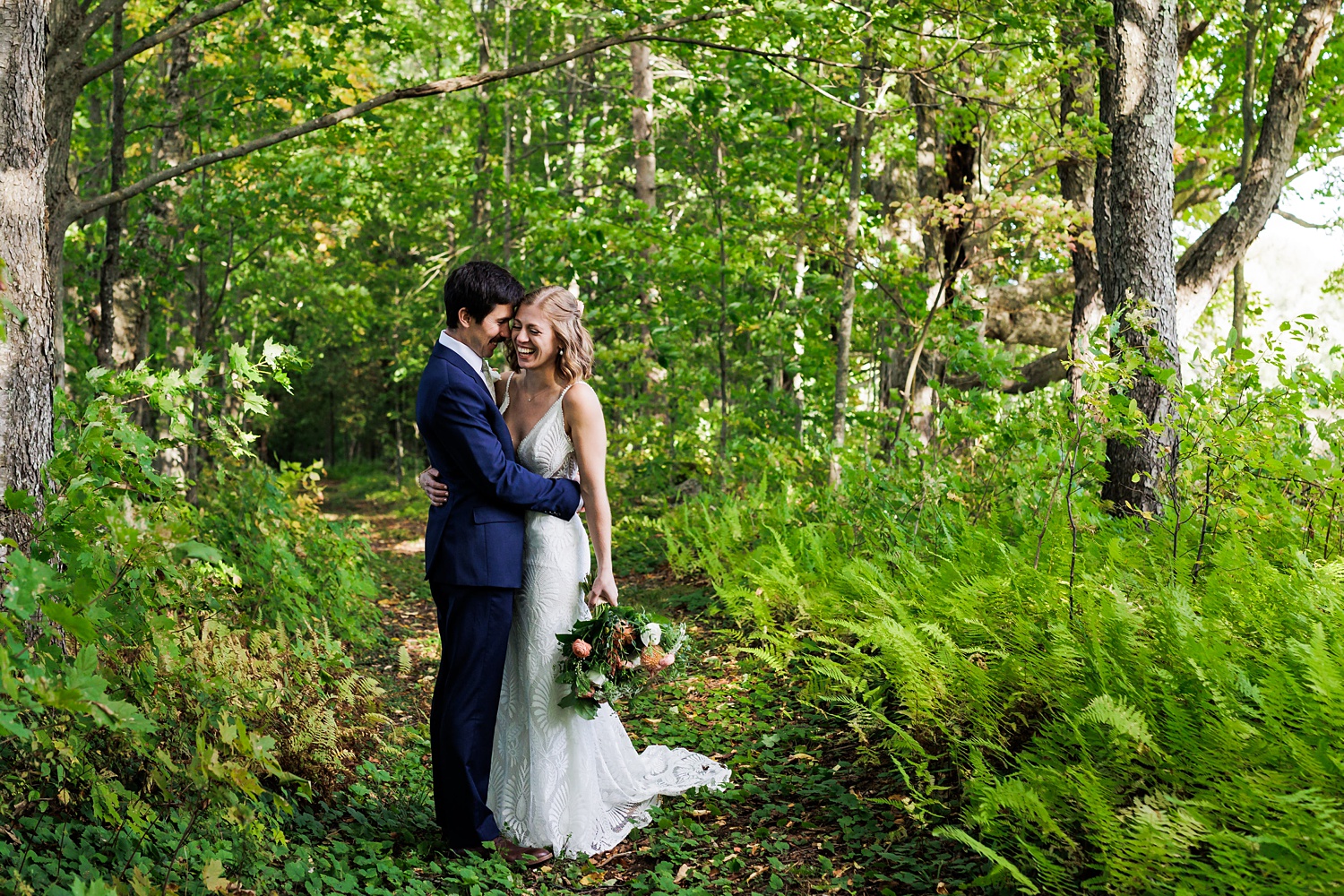 A little laughter from the married couple in the woods on their wedding day