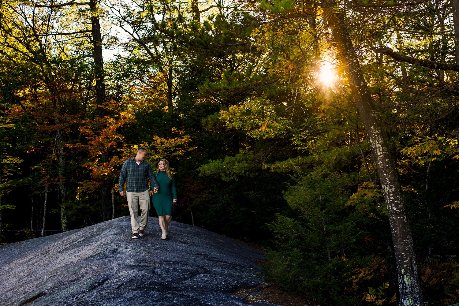 Walking in the woods of the White Mountains for their engagement session in fall