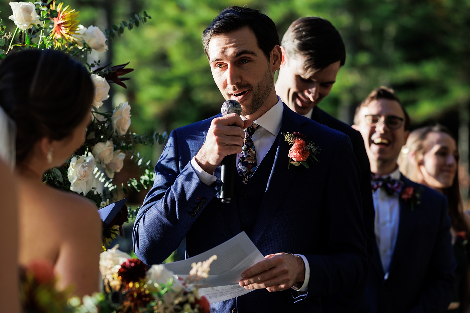 The groom reads his vows to his bride on their wedding day ceremony 