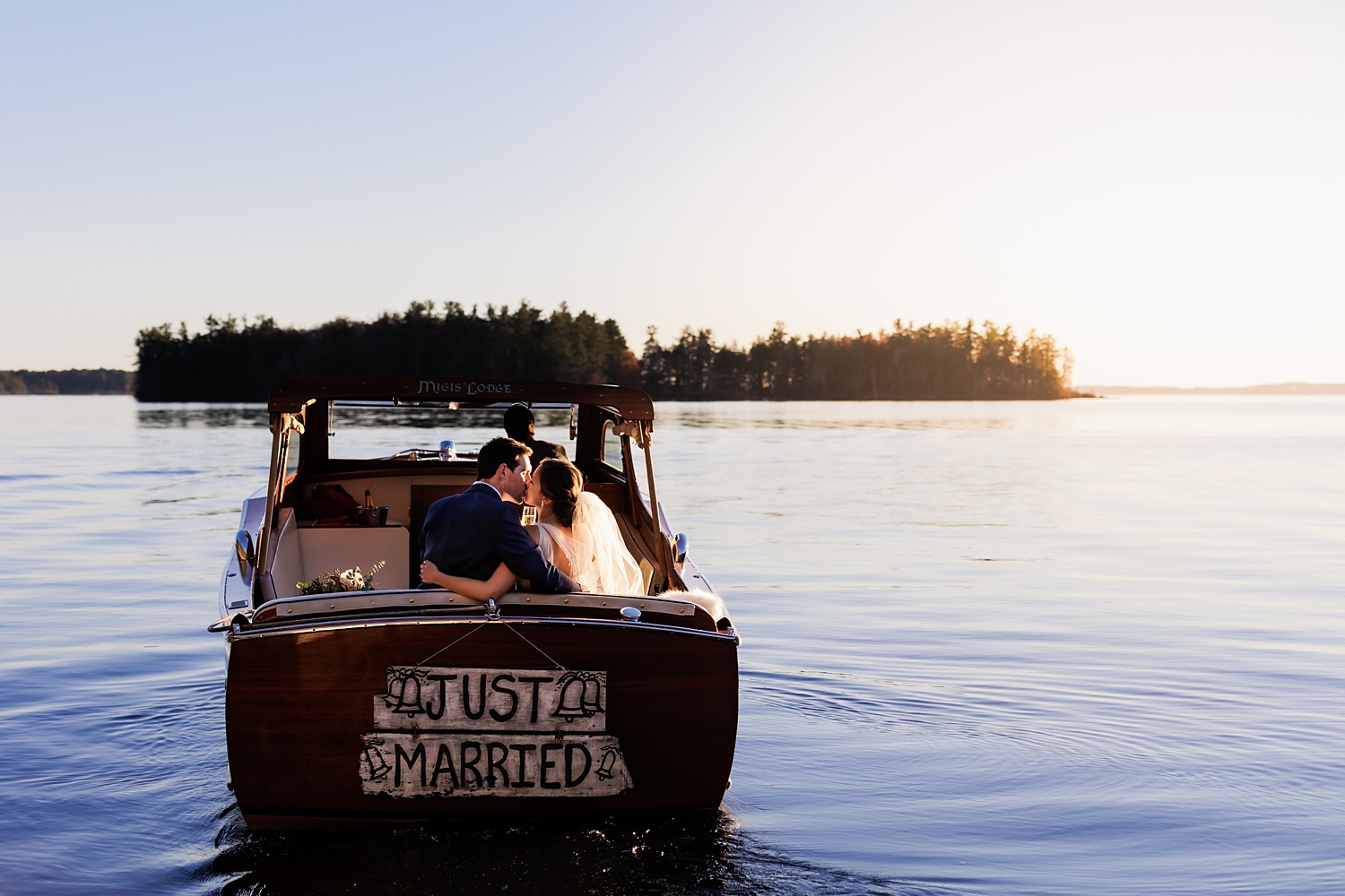 Just Married wedding couple on the boat at Migis Lodge Resort on Sebago Lake Maine