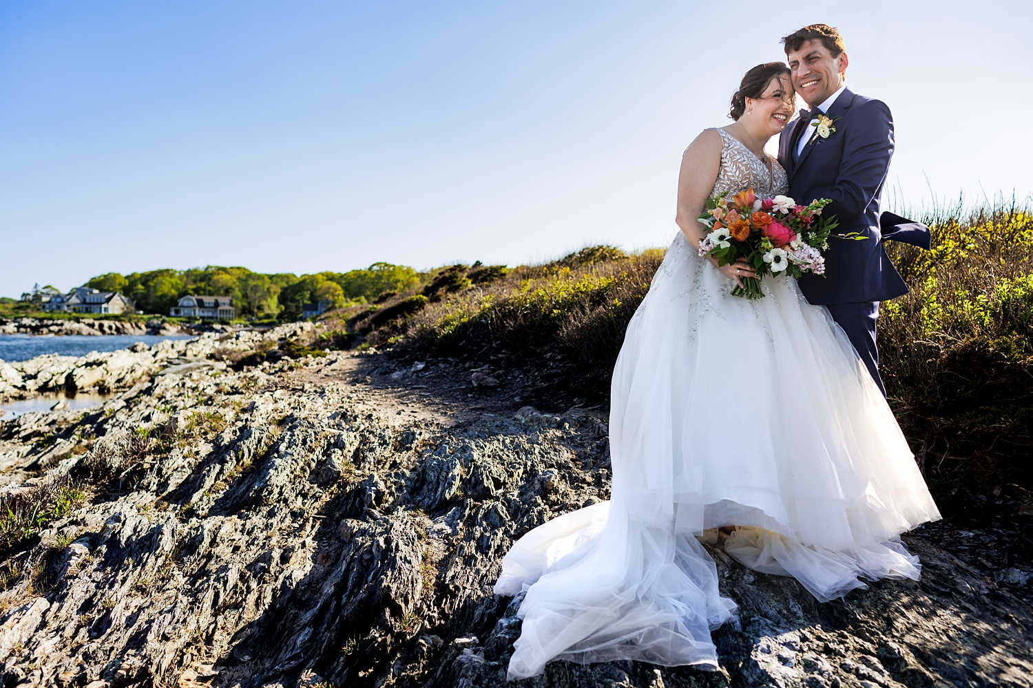After their Cape Elizabeth Maine ceremony, the newlyweds smile out on the cliffs at Trundy Point