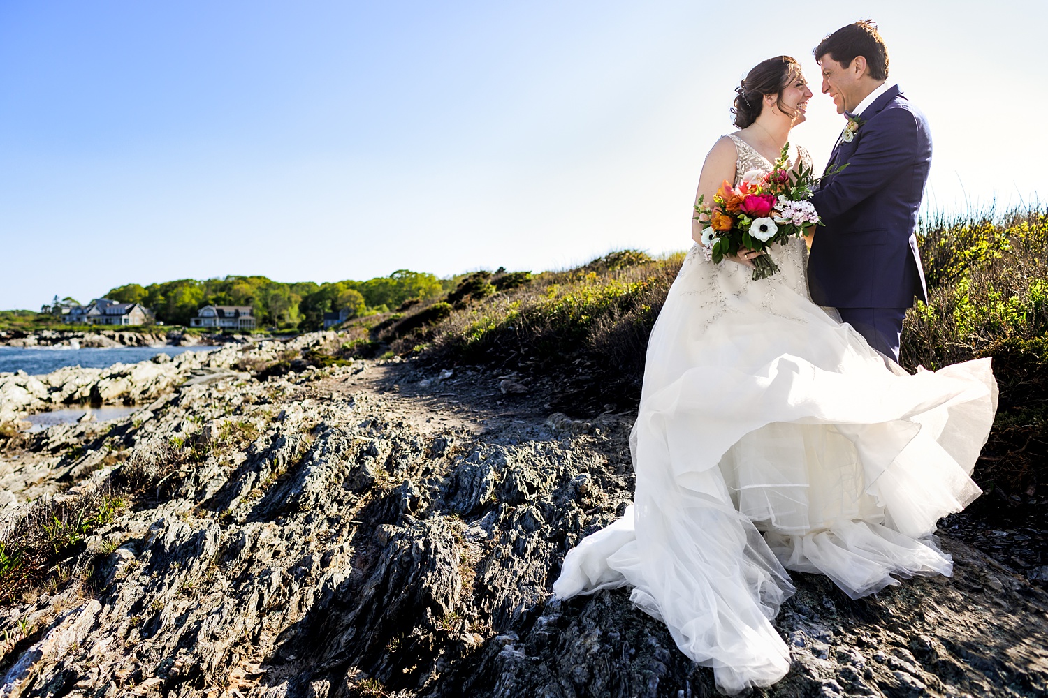 After their Cape Elizabeth Maine ceremony, the newlyweds smile out on the cliffs at Trundy Point