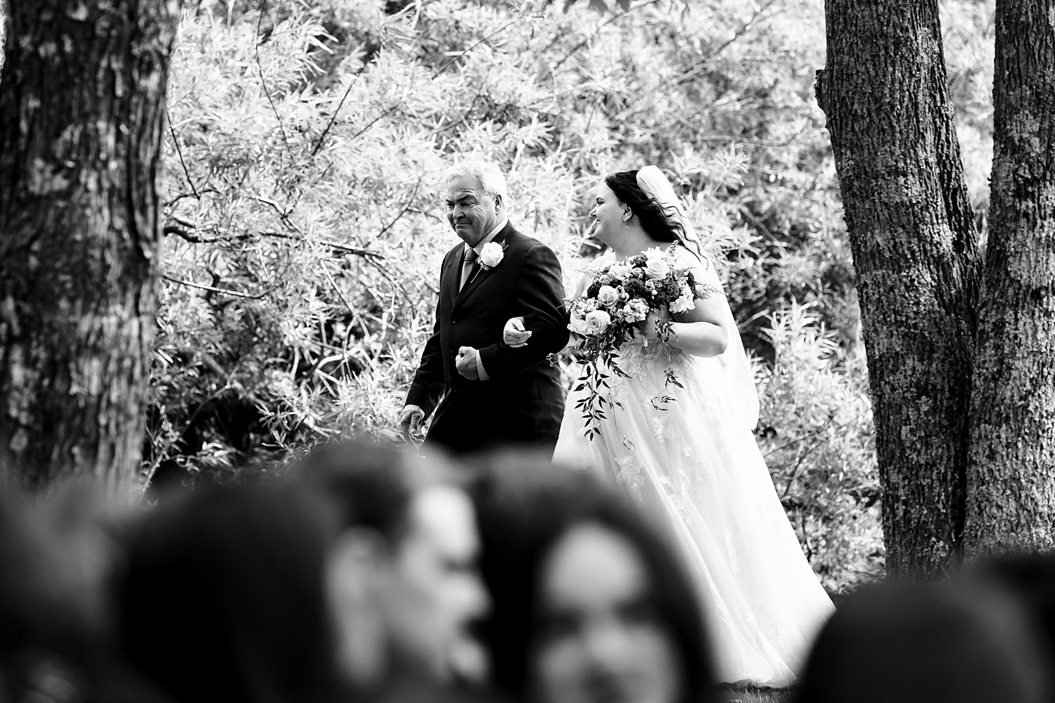 The bride and her father walk to the wedding ceremony site