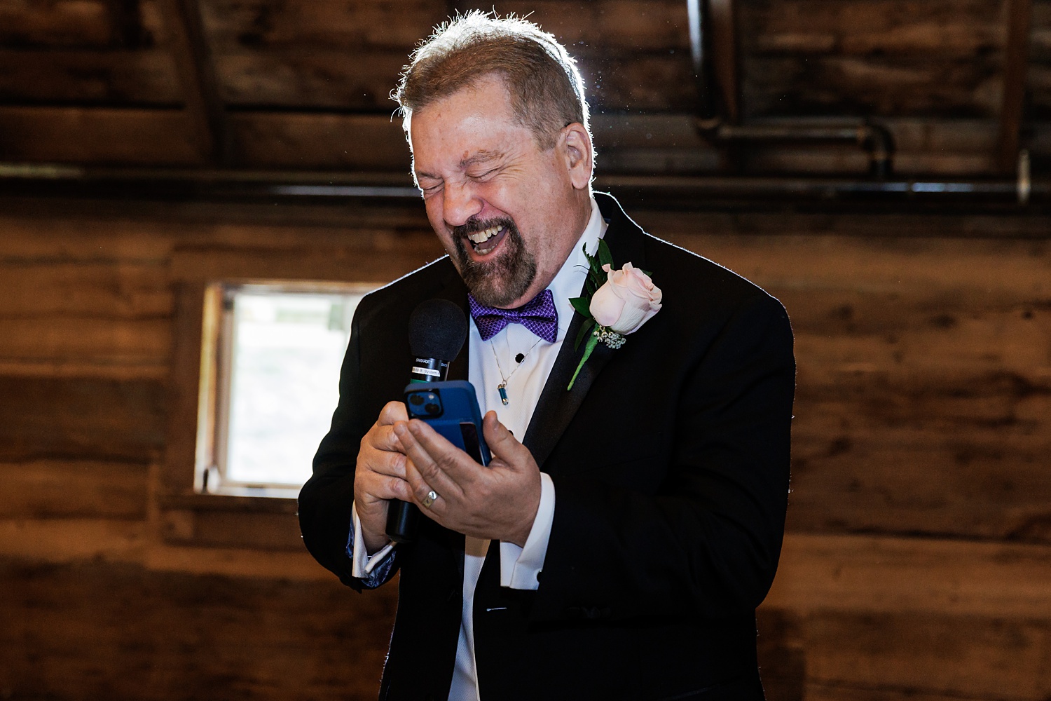 Father of the bride laughs to stop from crying during his toast