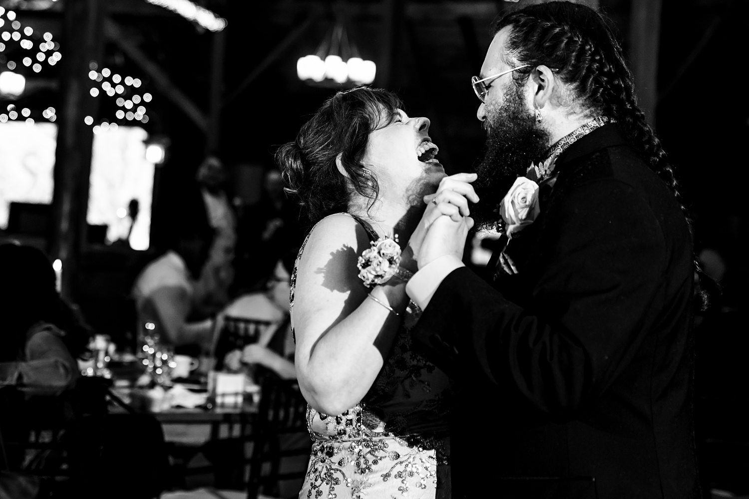 THe groom and his mom laugh it up on the dance floor