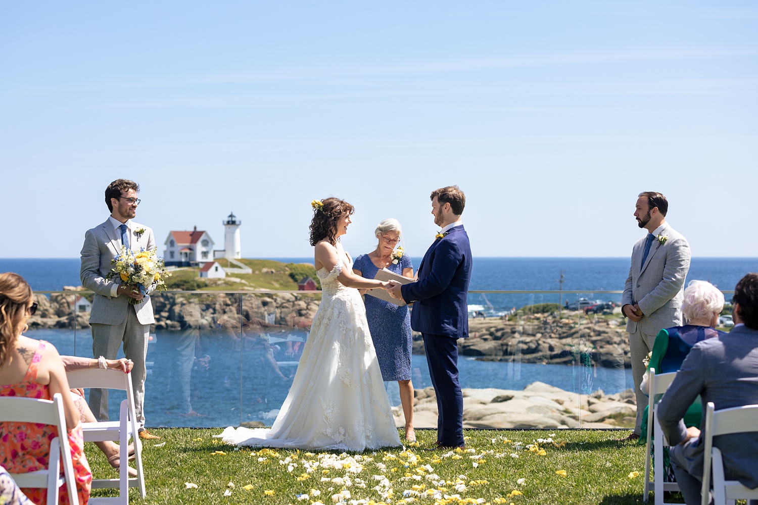 The wedding ceremony overlooking the lighthouse in York Maine at The Viewpoint Hotel