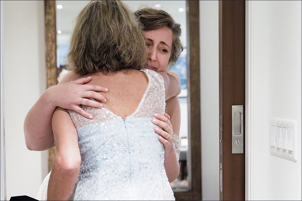 The bride and her mom share an emotional moment together