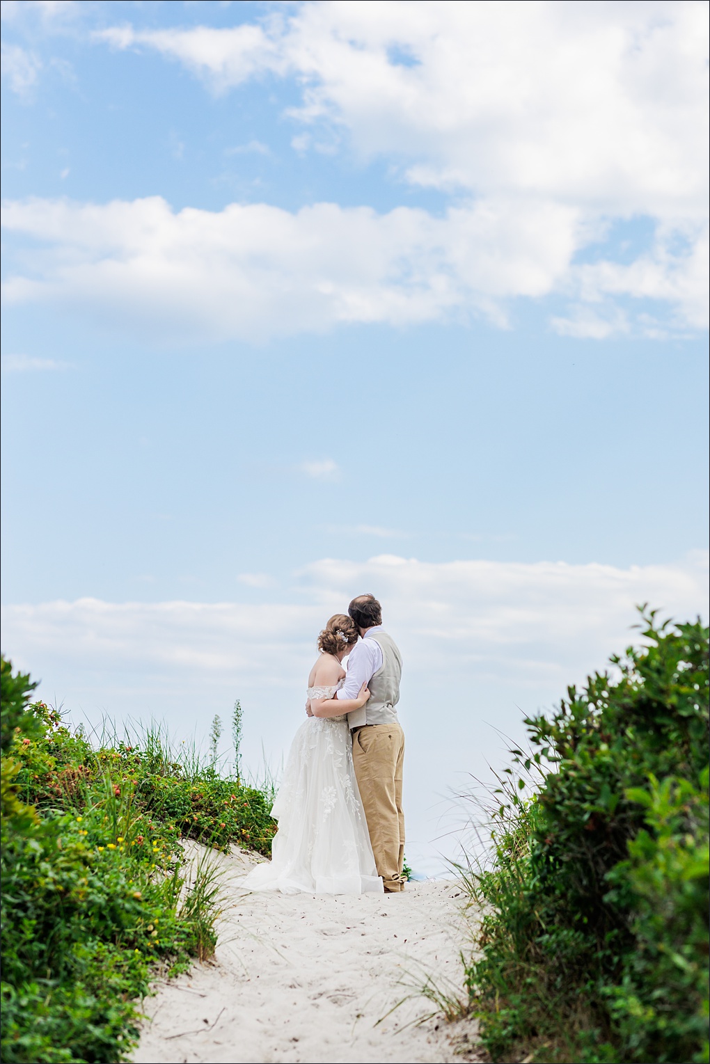 The bride and groom down by the beach in Cape Elizabeth Maine