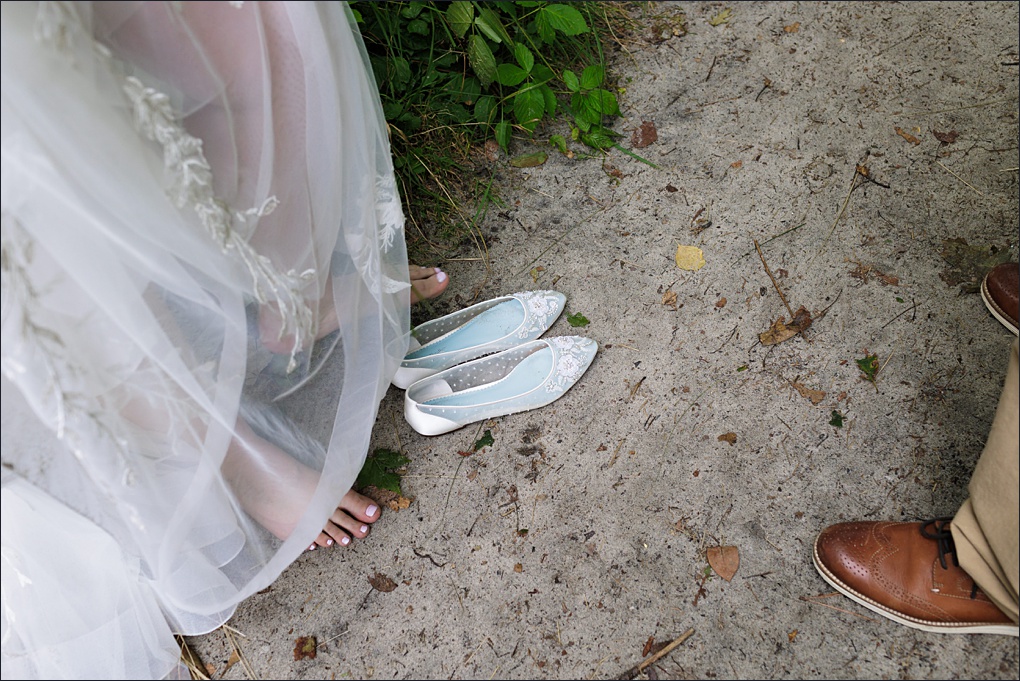 Slipping on the wedding day shoes after some beach time