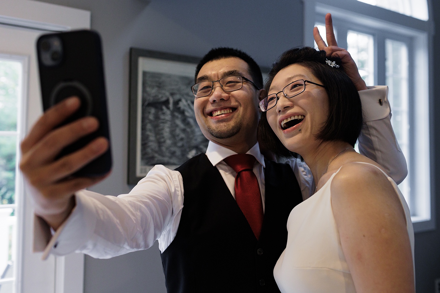 Bride and groom take a moment for a selfie on their New Hampshire Elopement